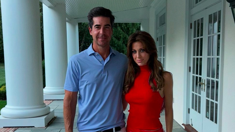 Emma DiGiovine Watters and husband Jesse Watters posing outside house