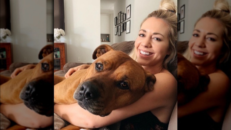 Samantha Cope on couch with dog