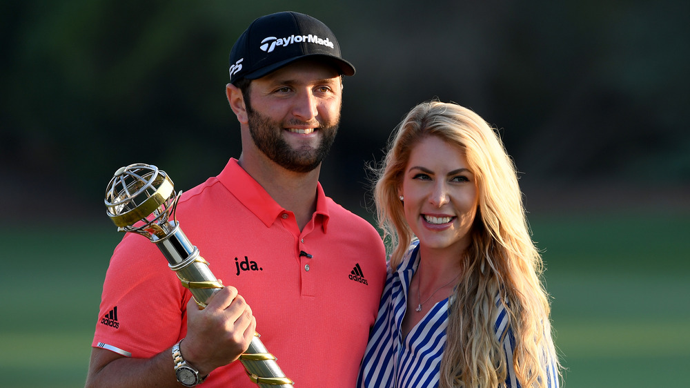 Jon Rahm kisses wife Kelley Cahill after winning 2023 Masters