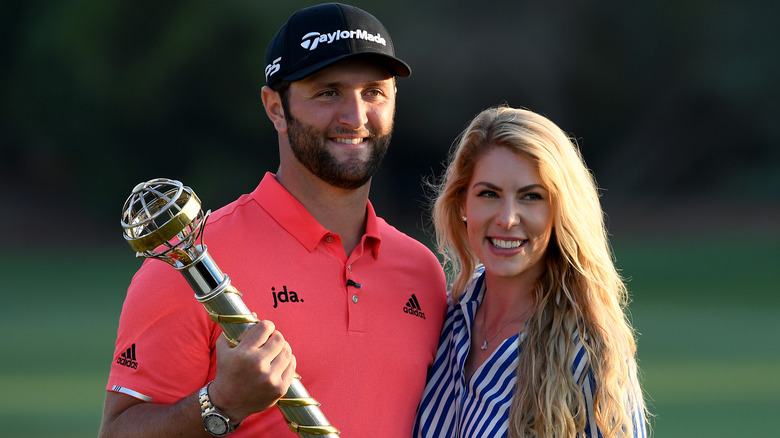 Jon Rahm posing with wife Kelley Cahill 