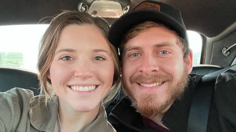 Joy-Anna Duggar and Austin Forsyth smiling in car