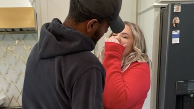 kailyn lowery and her boyfriend Elijah Scott smiling in the kitchen 