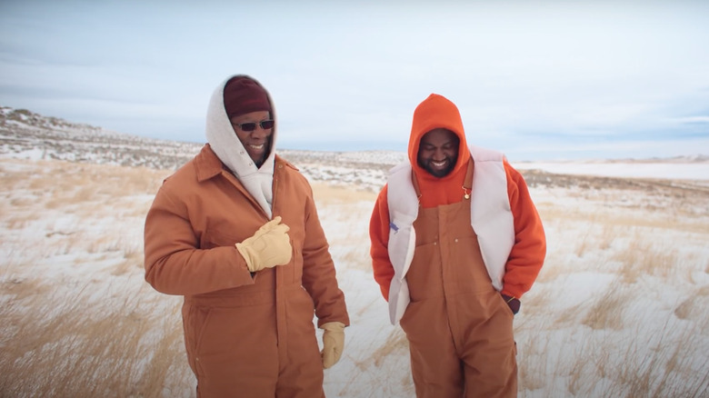 Ray West and Kanye West laughing 