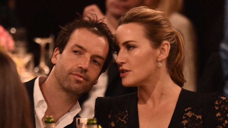 Kate Winslet talks to Edward Abel Smith at a table