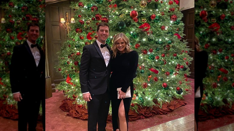 Cam  Arnold and Lauren Alaina in front of Christmas tree