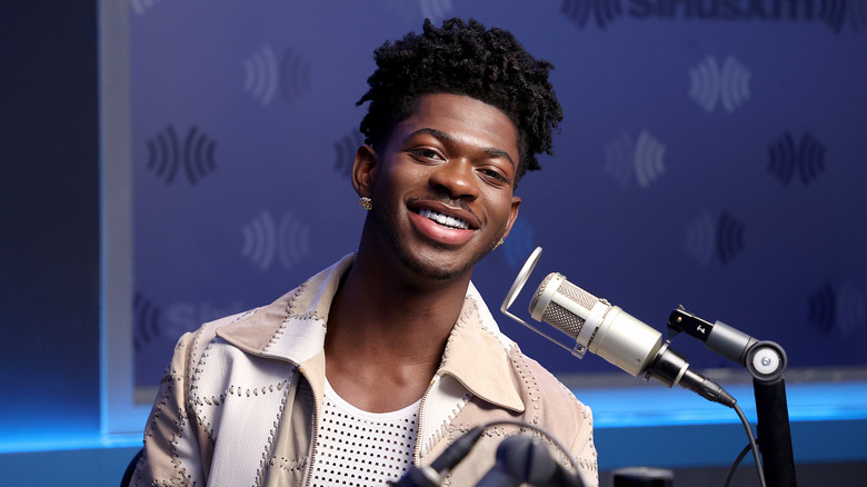 Lil Nas X's smiling during an interview