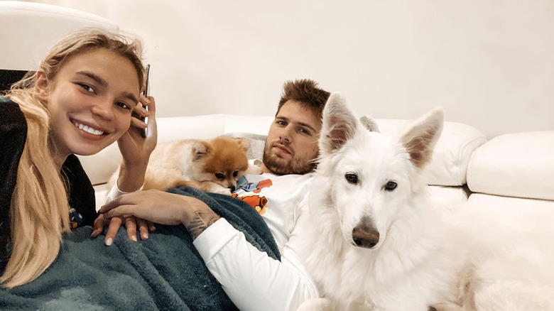 Anamarie Goltes with Luka Doncic and their dogs