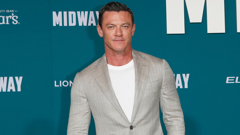 Luke Evans in grey blazer