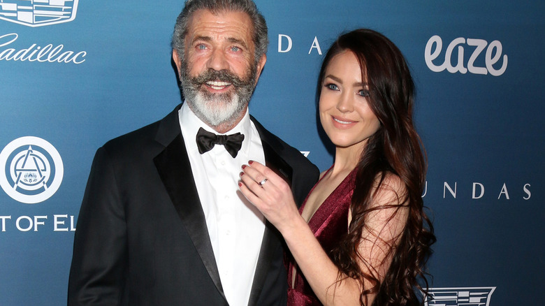 Mel Gibson and Rosalind Ross on a red carpet