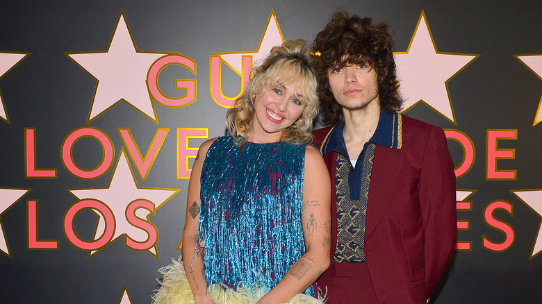 Miley Cyrus and Maxx Morando on the red carpet