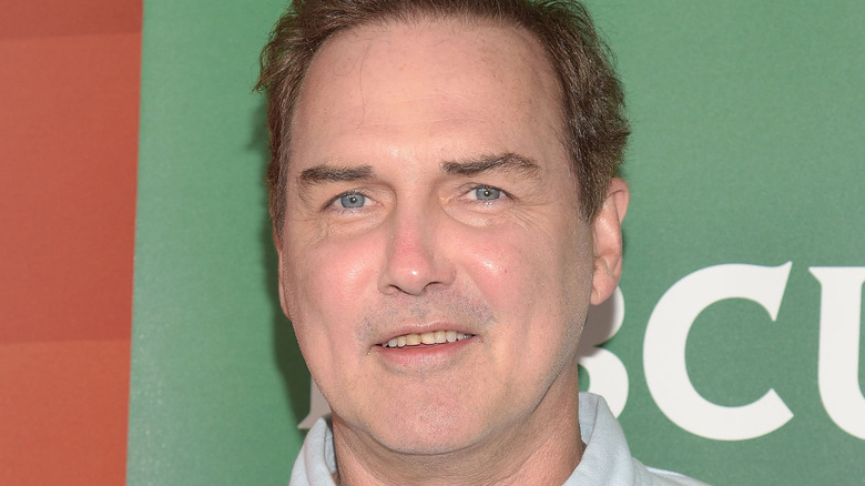 Norm Macdonald posing