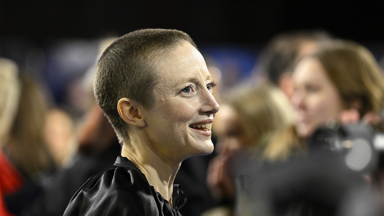 Andrea Riseborough smiling, side profile