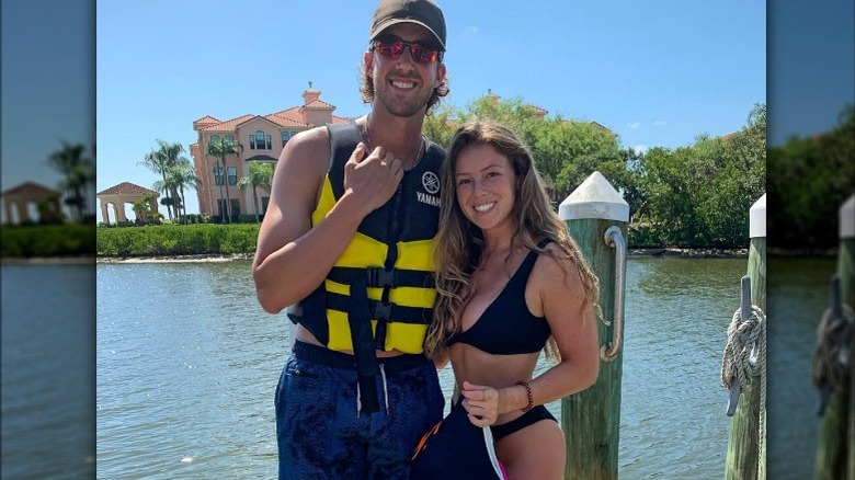 Aaron Nola and Hunter Jayde Harrington posing near water