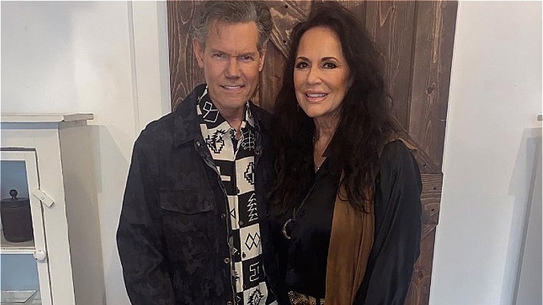 Randy Travis  holding wife Mary Davis