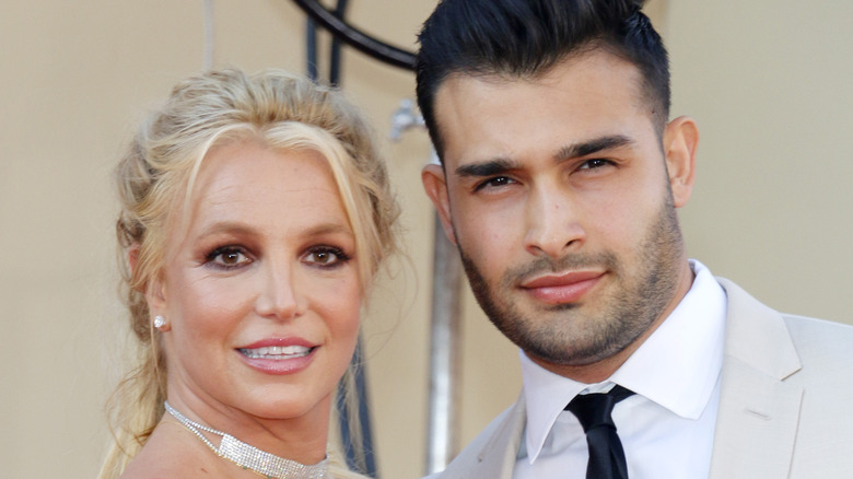 Britney Spears poses on the red carpet with Sam Asghari