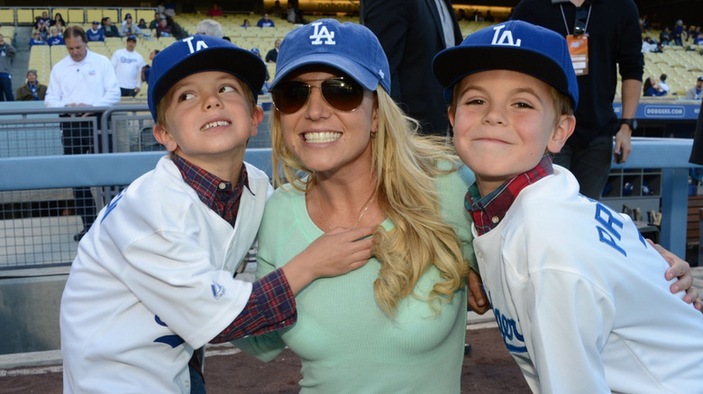 Britney Spears with her children at a baseball game