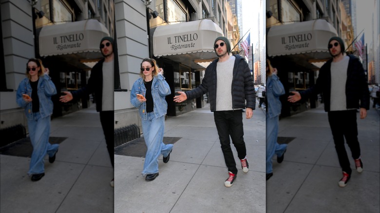 Rory St. Clair Gainer and Rebecca Ferguson walking together