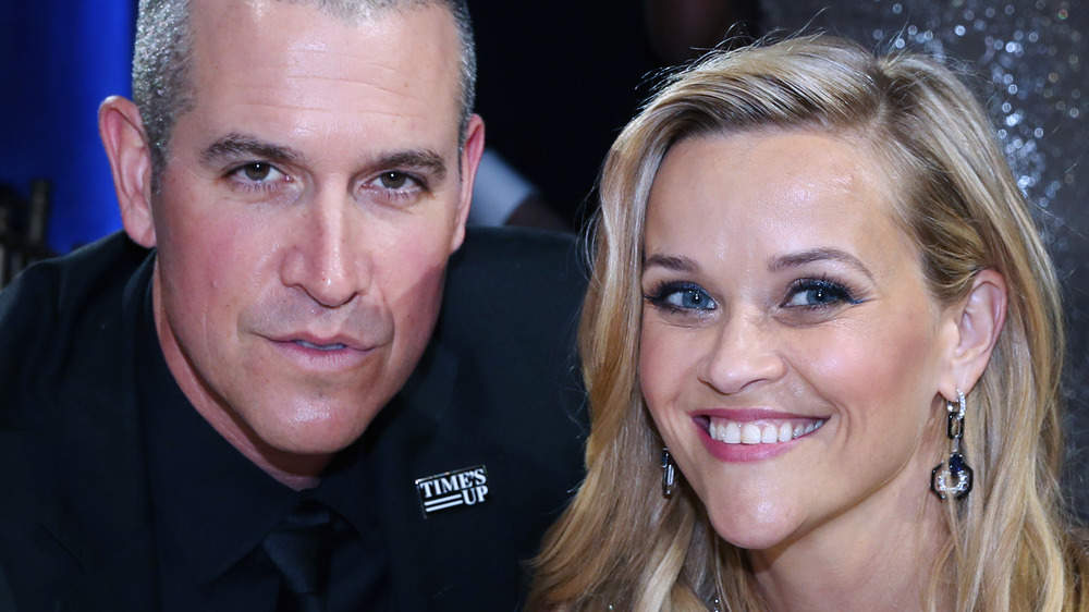 Jim Toth poses for a photo next to wife Reese Witherspoon