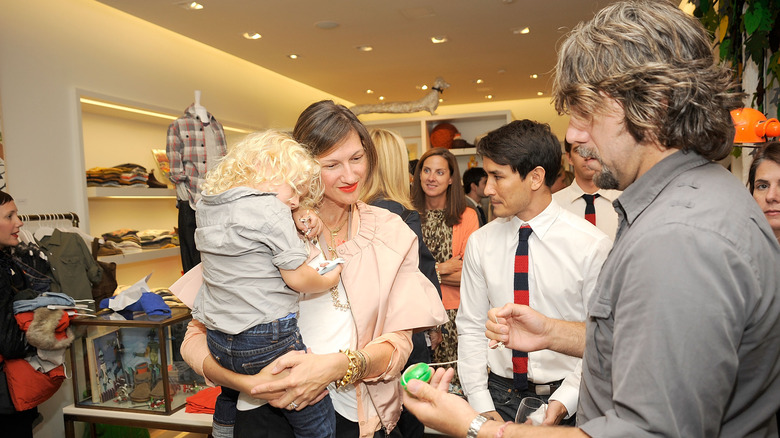 Jenna Lyons holds her son with Vincent Mazeau