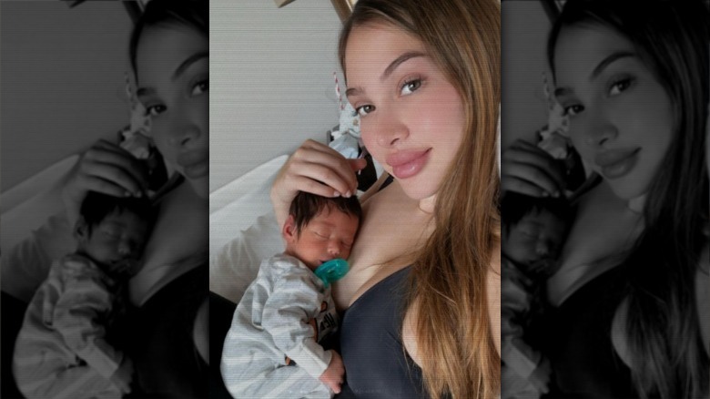 Drea Celina taking a selfie with her newborn baby