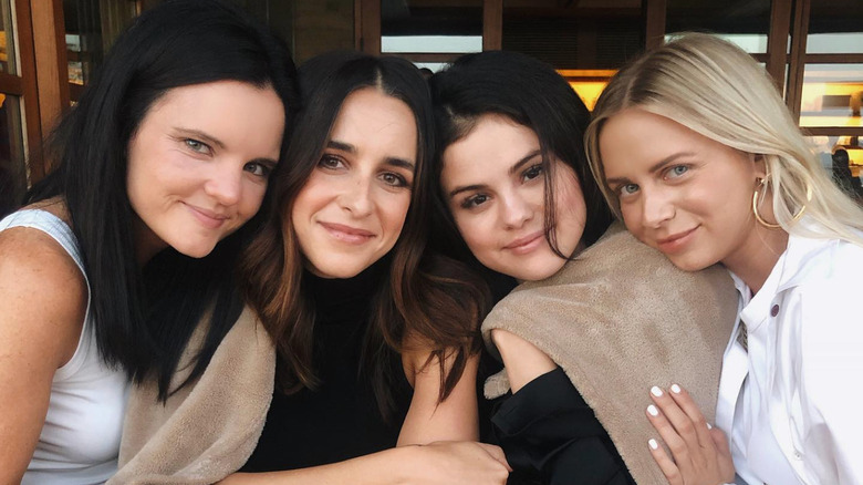 Selena Gomez and Raquelle Stevens posing with friends