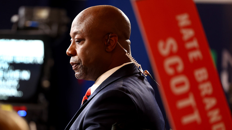 Tim Scott wearing a suit and earpiece