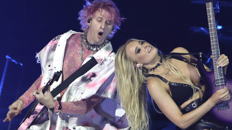 Machine Gun Kelly and Sophie Lloyd performing