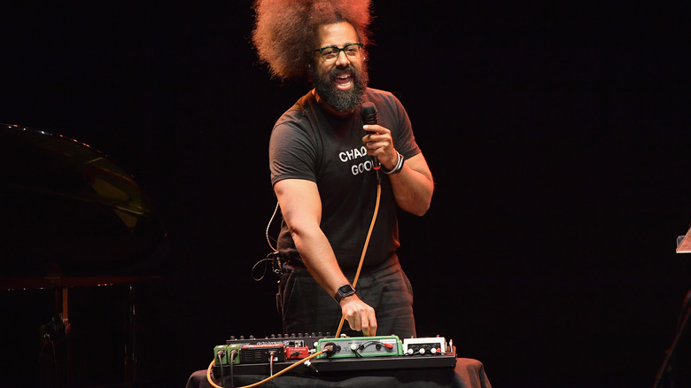 Reggie Watts on stage talking 