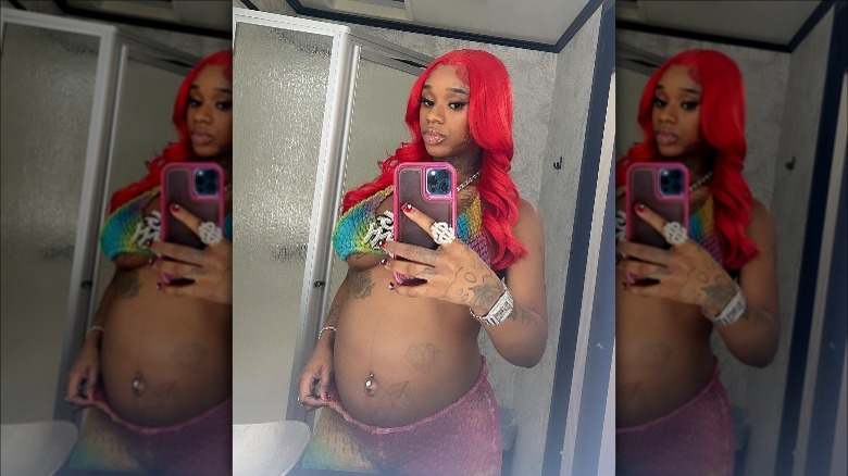 Sexyy Red taking selfie showing baby bump