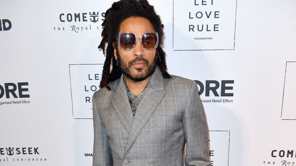 Lenny Kravitz gray suit square sunglasses