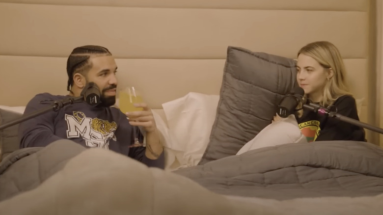 Drake and Bobbi sitting and talking in bed