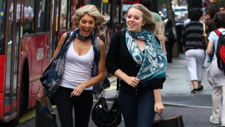 Marla Maples and Tiffany Trump walking through London on a windy day in 2009