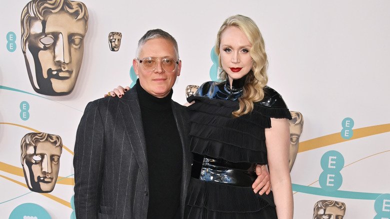 Giles Deacon and Gwendoline Christie posing