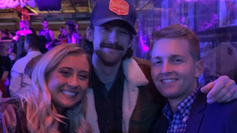 Erin Blaney, Ryan Blaney, and William Byron posing