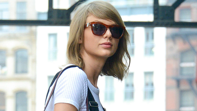 Taylor Swift wearing sunglasses outside her apartment