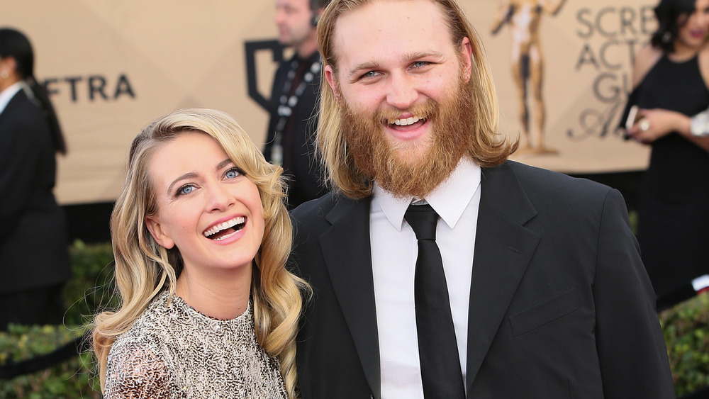 Meredith Hagner laughs alongside Wyatt Russell on the red carpet at the SAG awards