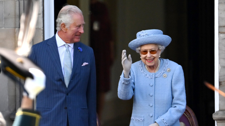 King Charles smiling at Queen Elizabeth