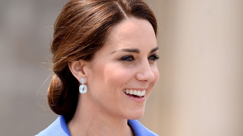 Kate Middleton smiling in side profile