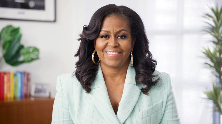 Michelle Obama looking at camera with wide smile