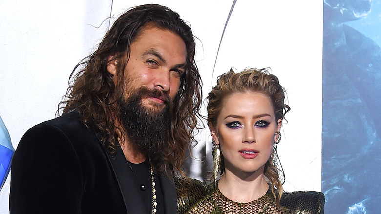 Jason Momoa and Amber Heard posing together