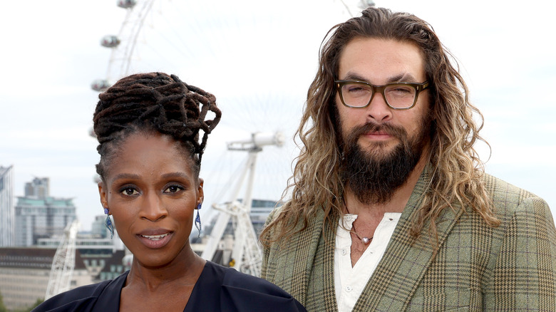 Sharon Duncan-Brewster and Jason Momoa posing together