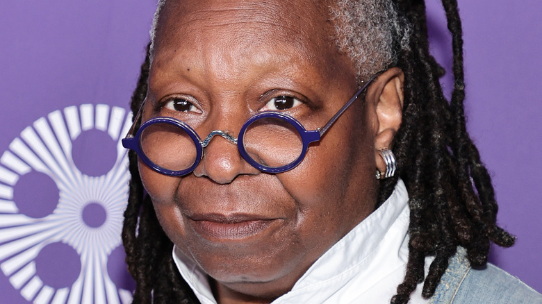 Whoopi Goldberg purple glasses