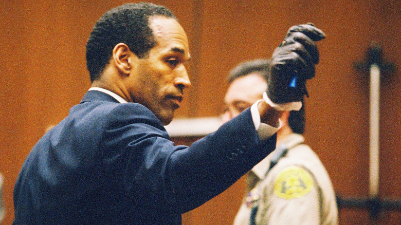 O.J. Simpson presenting the gloves in court