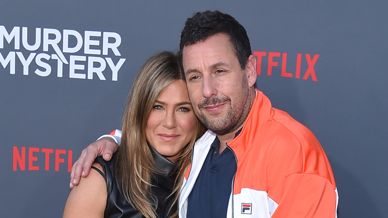 Adam Sandler and Jennifer Aniston hug