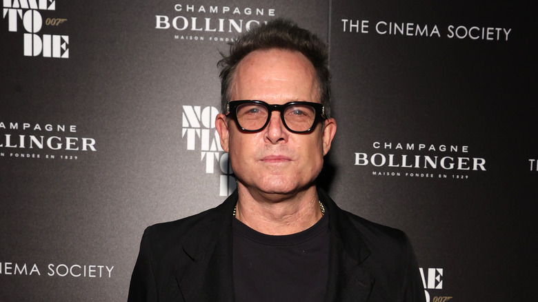 Dean Winters in black glasses 