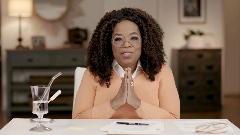 Oprah hands clasped together