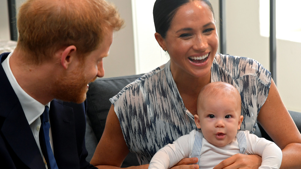 Prince Harry, Meghan Markle, and Archie smiling