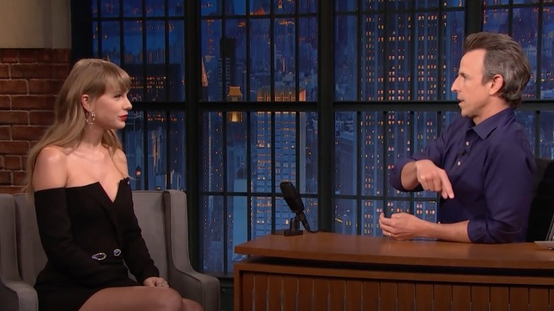 Taylor Swift speaking with Seth Meyers