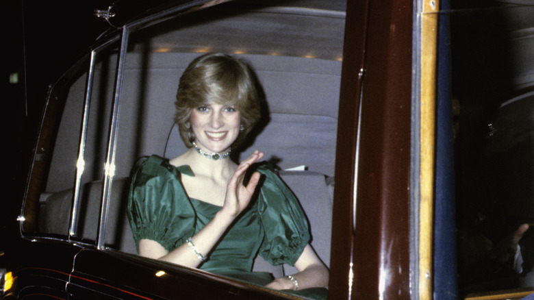 Princess Diana riding in backseat of chauffeured car