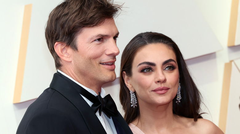 Ashton Kutcher and Mila Kunis attend the 94th Annual Academy Awards